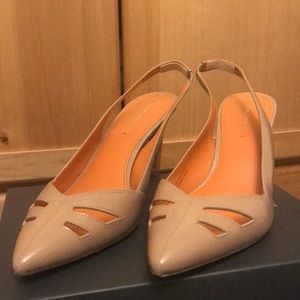 Nude closed toe slingback heels with cutouts